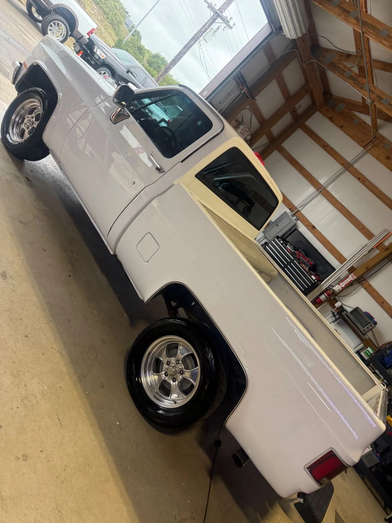 White classic pickup truck in the detailing shop